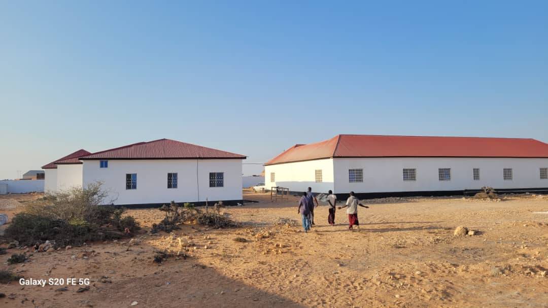 Two completed hall blocks with red roofing