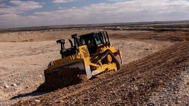 Bulldozer cutting and levelling ground during bulk earthworks